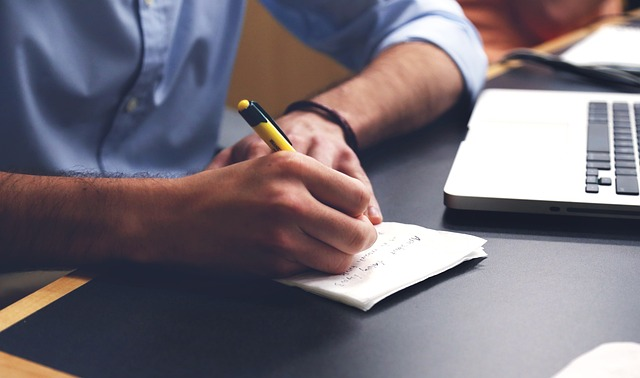 Tips for Making Cost-Based Pricing Work for Your Business 2 man doing the math for cost plus pricing strategy