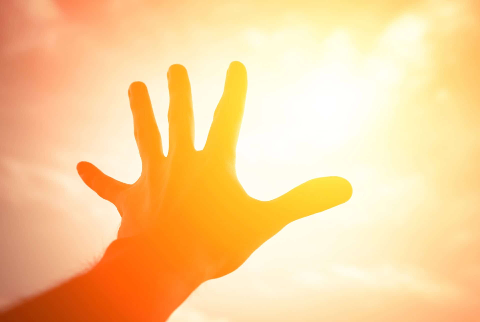 TikTok vs YouTube Shorts: What is the Best Platform for Short Videos? 2 hand reaching into the sun - reaching your audience