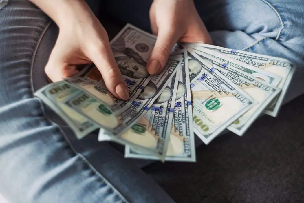fan of 100 U.S. dollar banknotes - compete on price
